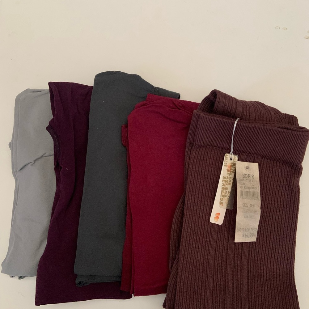 4 pair of trouser socks and 4 pair of tights. 1 pair of footless rib tights